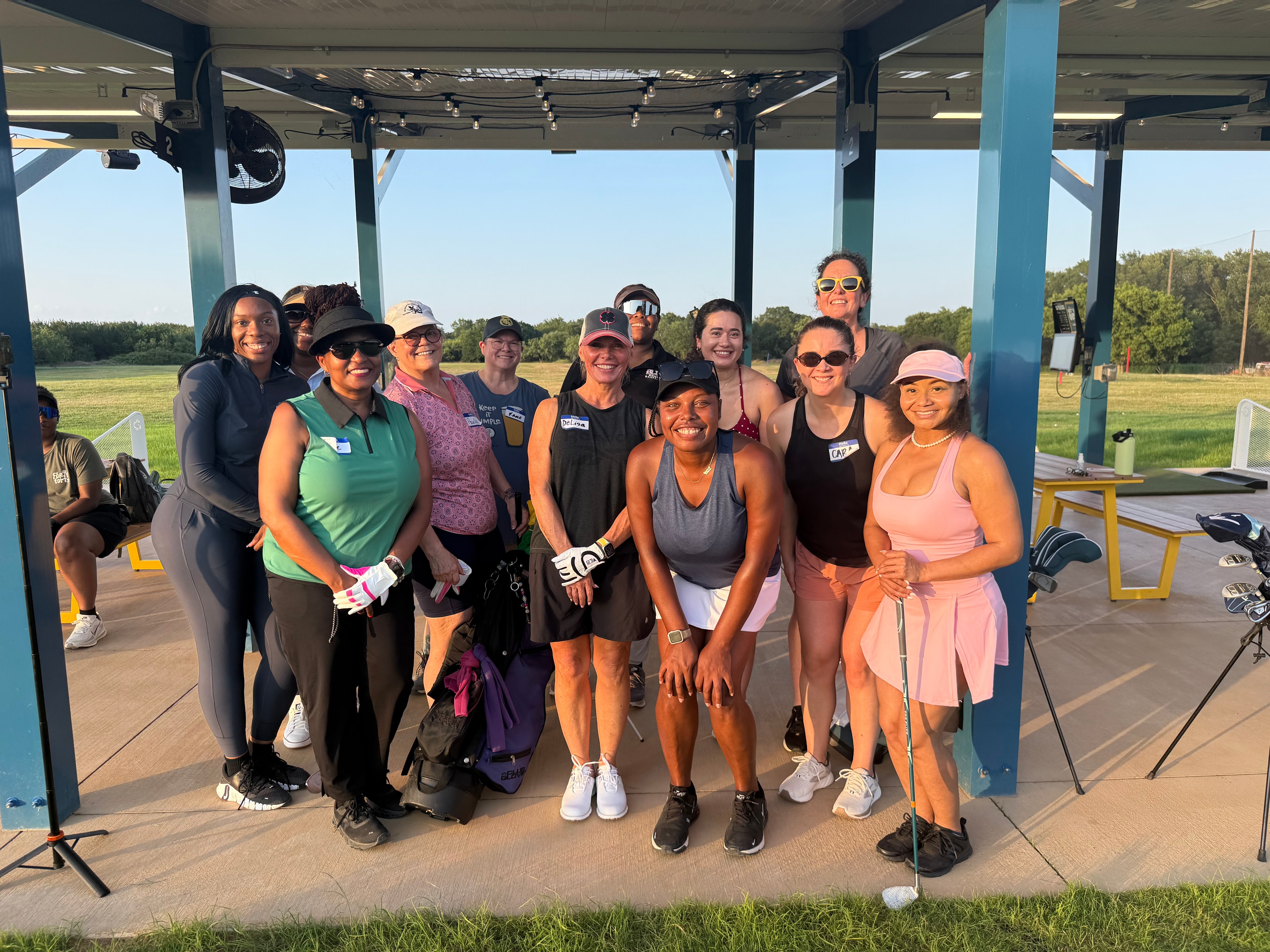 Woman golfer swinging club on sunny course